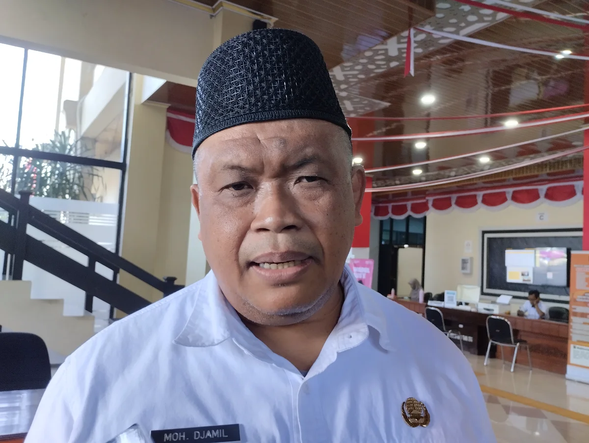 Kepala DPMD Jember, Mohammad Djamil saat membetikan keterangan. (Dok. Pojoksatu.id/David Tomi Anggara)