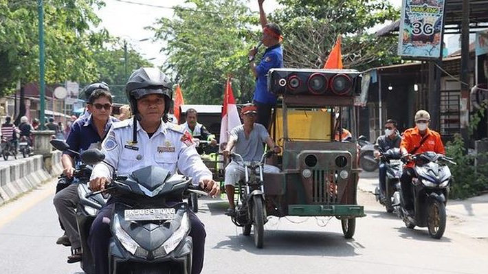 Peringati May Day, Puluhan Buruh Lakukan Pawai Damai dan Bakti Sosial di Tanjung Balai